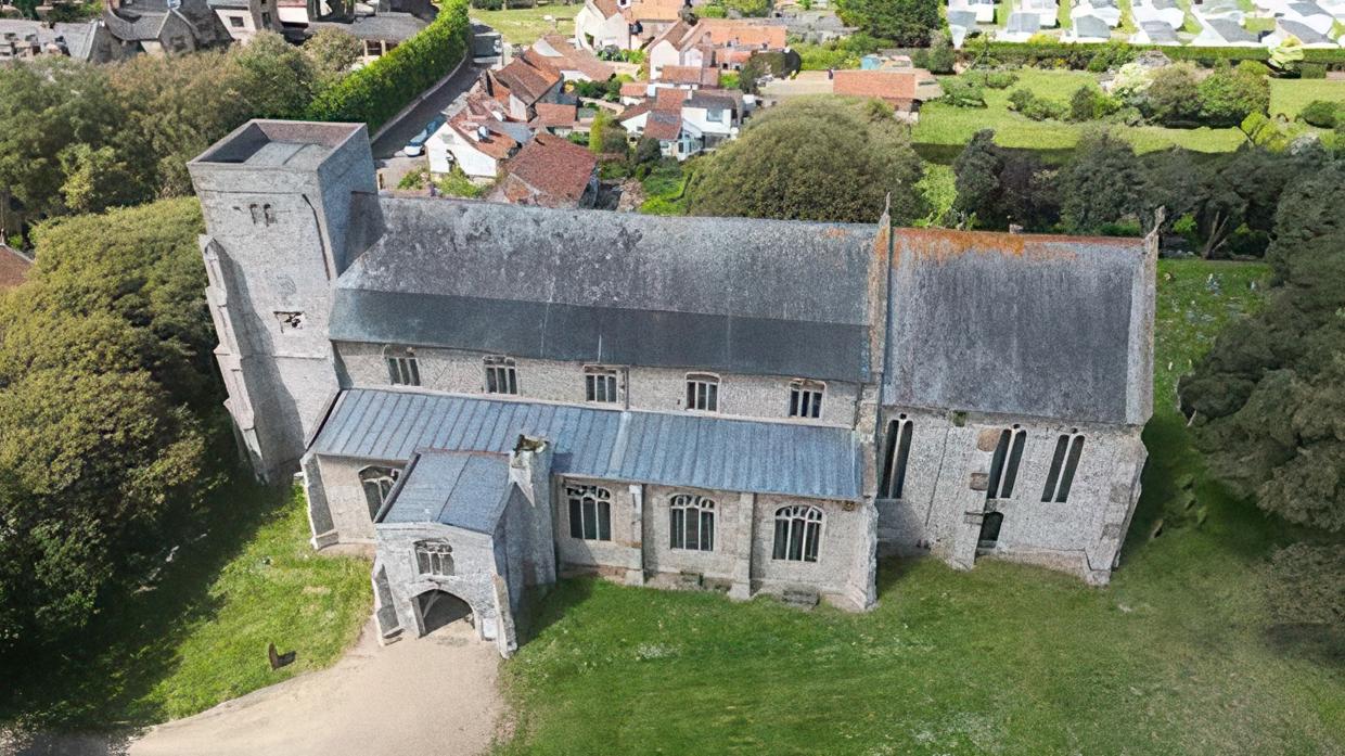 An aerial view of All Saints Church, Thornham